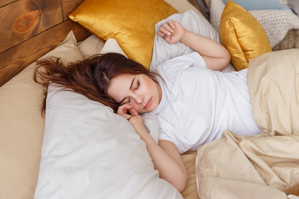 Sleeping Girl with Gold and White Pillows